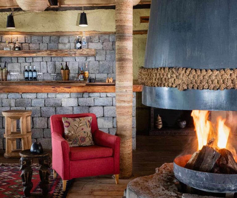 volcanoes-safaris-virunga-lodge-bar-fireplace.jpg