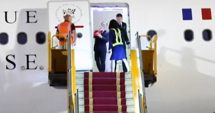Macron’s wife shoves him on plane in moment caught on video - National