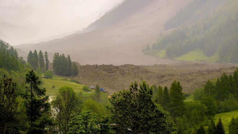 Rock slide hits Swiss Alpine village that authorities had ordered evacuated
