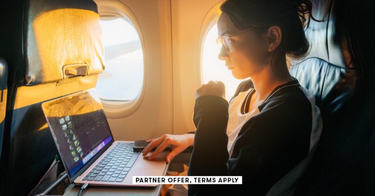 SOCIAL-IMAGE_PARTNER-OFFER-TERMS-APPLY_Woman-working-with-laptop-in-the-airplane_Oleh_Slobodeniuk_24.jpg