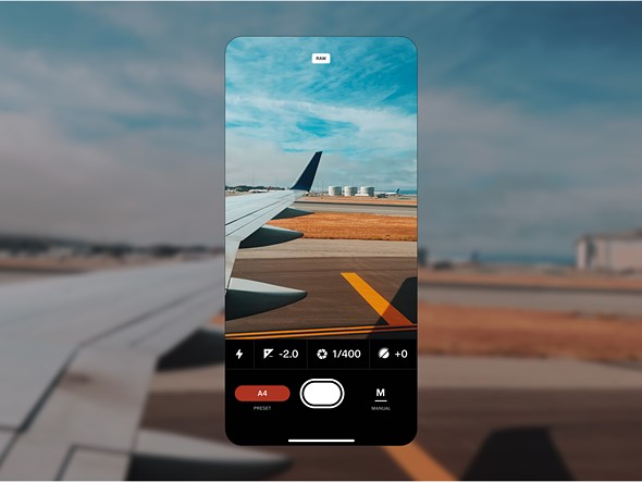 a_screenshot_of_phone_with_the_vsco_creator_app_is_placed_against_a_photo_of_an_airplane_on_a_runway.jpeg