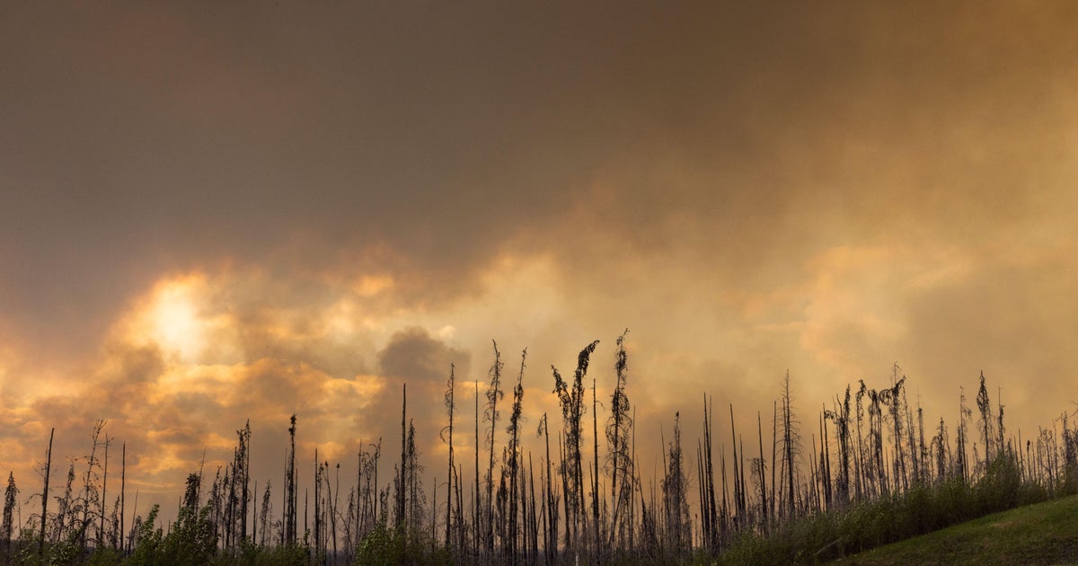 Canadian wildfires force tens of thousands evacuate, threaten U.S. air quality