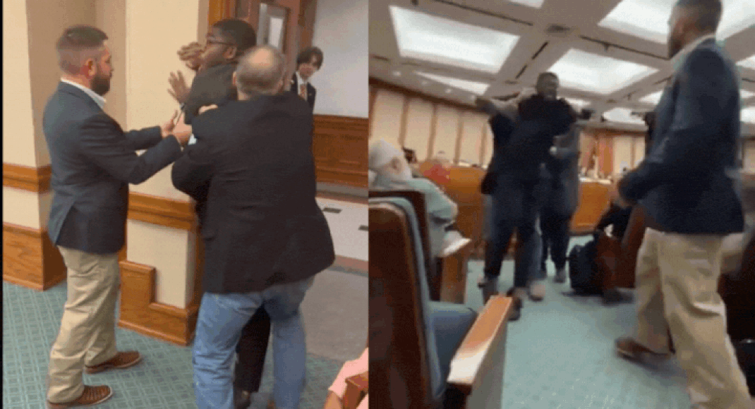 'America will rise up against you!': Texas Democrat dragged out of meeting for yelling, officer falls on him – watch video