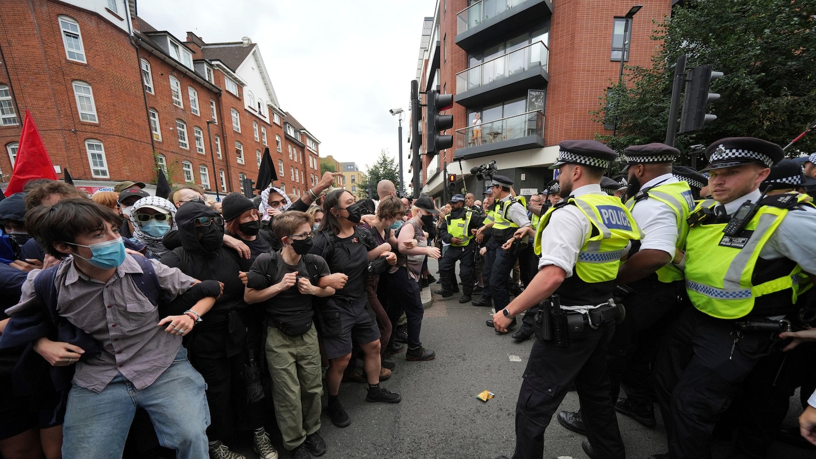 Rival anti-migrant and anti-racism protests face off outside a hotel housing migrants in London
