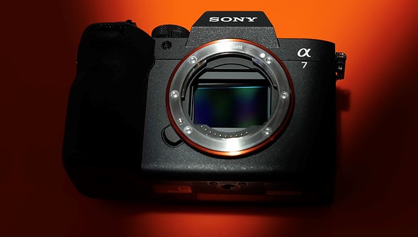 sony_a7v_sharply_lit_orange_background.jpeg