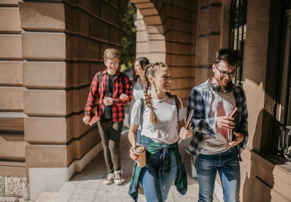 Group-of-students-walking-in-university-campus_freemixer.jpg